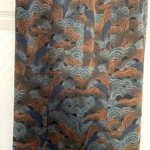 Maxi length Hinge knitting in grey, blue, rust pattern. Lined to knee.